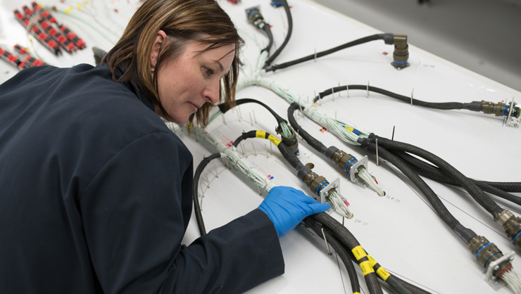 Engineer working on electrical components